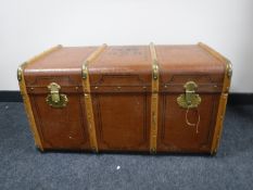 An early 20th century wooden bound trunk