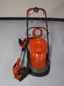 A Flymo hover vac with lead and box,