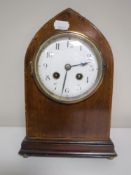 A late 19th century mahogany cased arched topped mantel clock