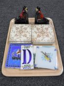 A tray containing a pair of early 20th century china bookends together with eleven Victorian and