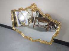 An ornate gilded framed mirror