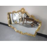 An ornate gilded framed mirror