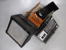 A Marlin guitar amplifier together with a Grundig C6000 five band radio and a box containing