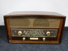 A mid 20th century walnut cased Monark valve radio