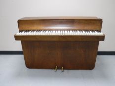 A walnut cased over strung mini piano by Louis Zwicki