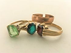 Three 9ct gold dress rings and a band ring, 8.