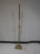 A decorative brass standard lamp