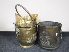 Two brass lion mask coal buckets and one other
