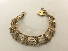 A 9ct gold padlock bracelet, 10.