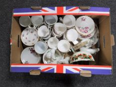 A box containing assorted tea china,