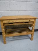 A blonde oak sewing table