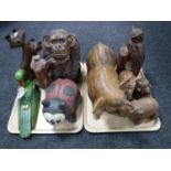 Two trays of wooden carvings, animals,