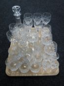 A tray of assorted lead crystal drinking glasses and a decanter