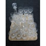 A tray of assorted lead crystal drinking glasses and a decanter