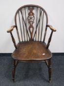 An antique Windsor kitchen armchair