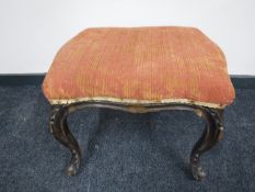 An antique French dressing table stool