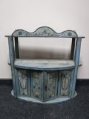 An early 20th century hand painted wall shelf fitted with a cupboard