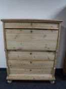 An antique stripped pine secretaire chest