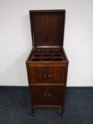 A mahogany radiogram cabinet converted to a drinks cabinet CONDITION REPORT: No key