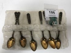 Six silver gilt black enamel spoons by David Andersen and a pair of silver two-colour enamel