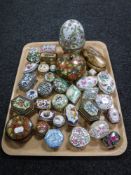 A collection of wooden and china pill boxes,