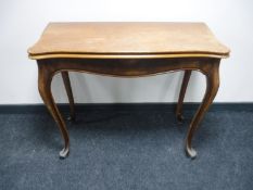 A mahogany foldover tea table