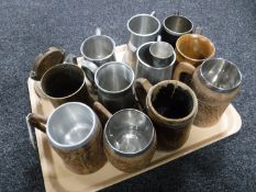 A tray of assorted tankards and a wooden pocket watch stand