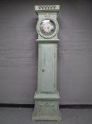 A continental painted longcase clock with pendulum and weights