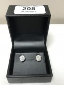 A pair of 18ct white gold diamond stud earrings, the total diamond weight estimated at 2.