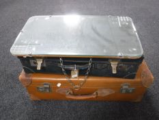 Two vintage luggage cases and an unframed mirror