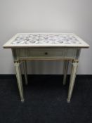 A 20th century cream and gilt painted side table