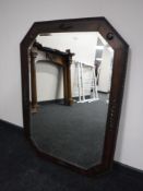 A large Edwardian oak framed mirror