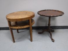 A circular deco two tier occasional table and a mahogany wine table