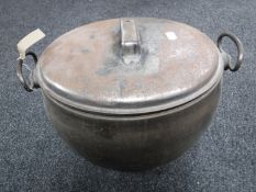 An antique cast iron four gallon cooking pot with lid by A.