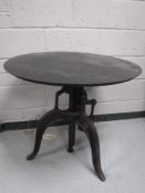An industrial adjustable pub table CONDITION REPORT: This is a modern table.