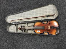 A late 19th century violin and bow in coffin case CONDITION REPORT: Surface wear,