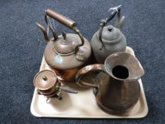 A tray containing two copper kettles, antique copper jug,
