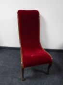 An antique mahogany nursing chair