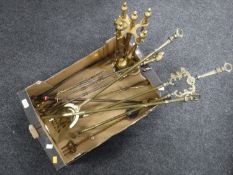A box of four piece brass companion set, antique fire irons,