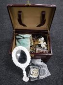 A lady's leather vanity case of hand mirror and assorted costume jewellery