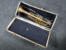 A cased Bass Bundy trumpet in case
