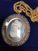 A fine quality Georgian gold memorial pendant, the rose-coloured frame with blue and white enamel,