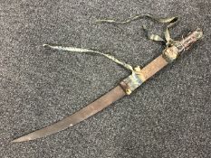 A late 19th century leather handled sword