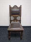 An Edwardian carved oak dining chair