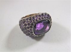 An 18ct white gold and amethyst cluster ring, 16.