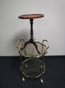 A brass octagonal two tier serving trolley with lift off tray together with a mahogany red leather