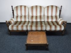 A late 20th century three seater wooden framed settee and a matching side table