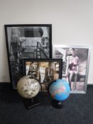 Two globes on stands together with three contemporary framed prints