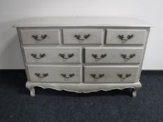 A contemporary French style seven drawer chest