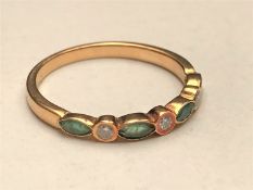 A diamond and emerald half-eternity ring,